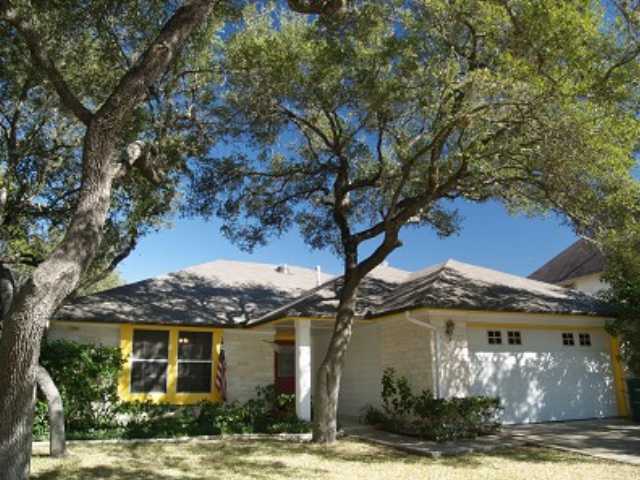 7817 Wheel Rim Circle Austin, TX 78749 - Photo 1 of 1 a front view of a house with garden