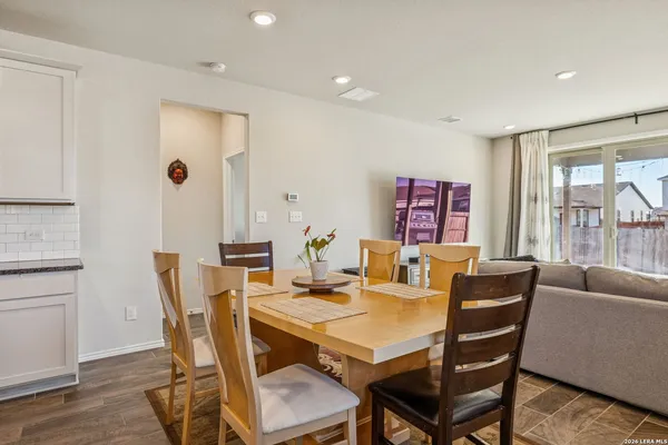 a view of a dining room with furniture window and outside view