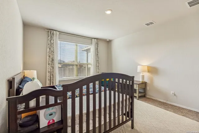 a bedroom with furniture and a window
