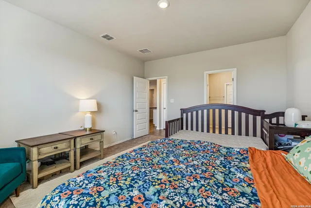 a bedroom with bed and a window