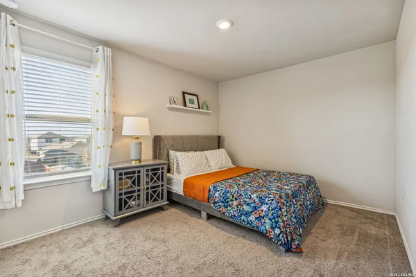 a bedroom with a bed and a cabinets