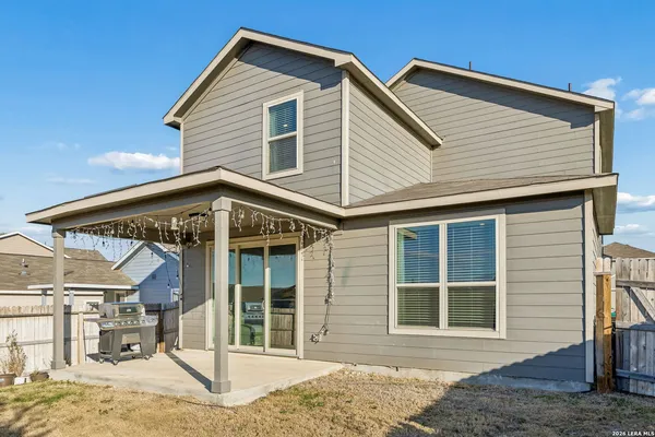 a view of a backyard of the house