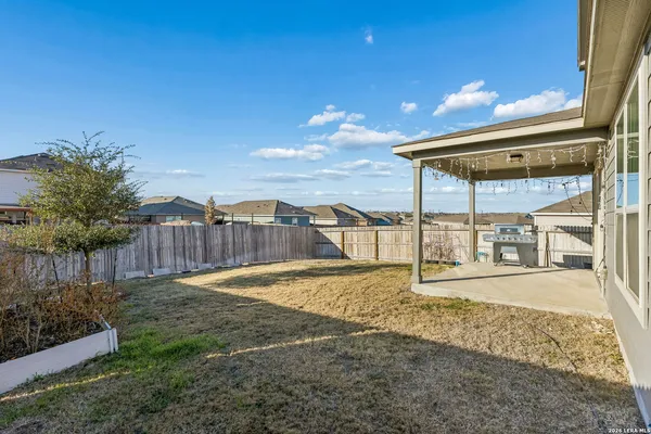 a picture of a bench in front of a house