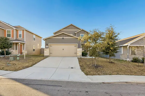 a front view of a house with garage