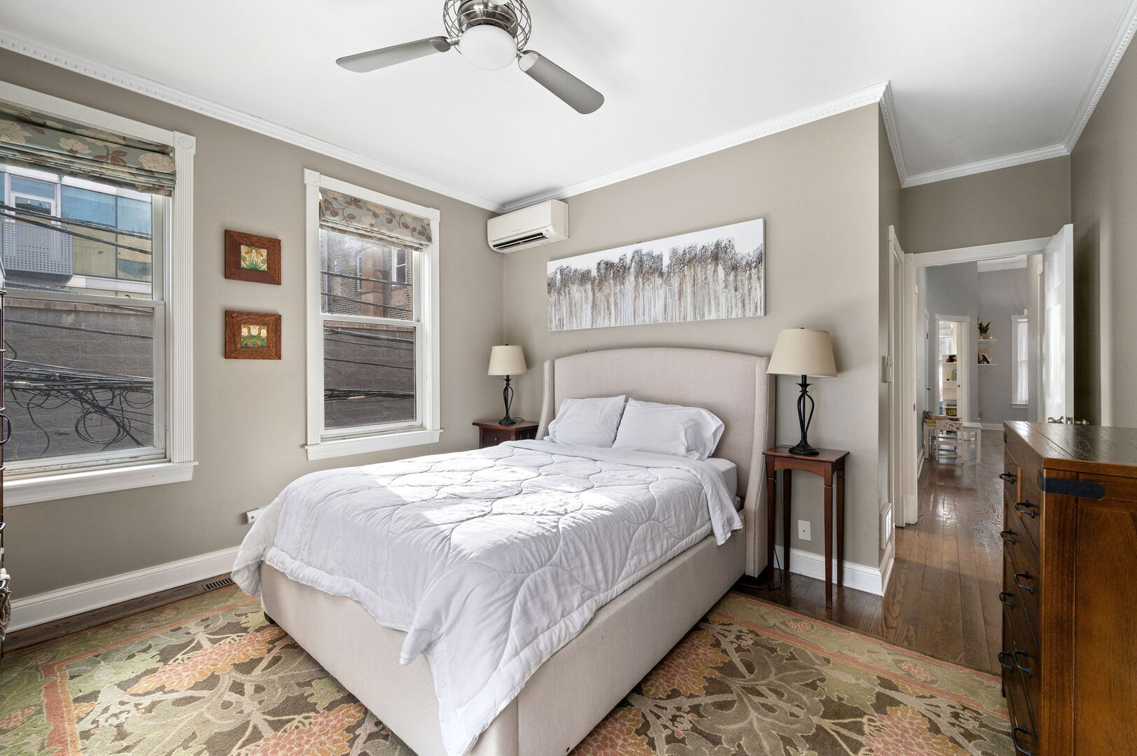 1213 North Paulina Street Chicago, IL 60622 - Photo 18 of 40 a bedroom with a large bed and a window