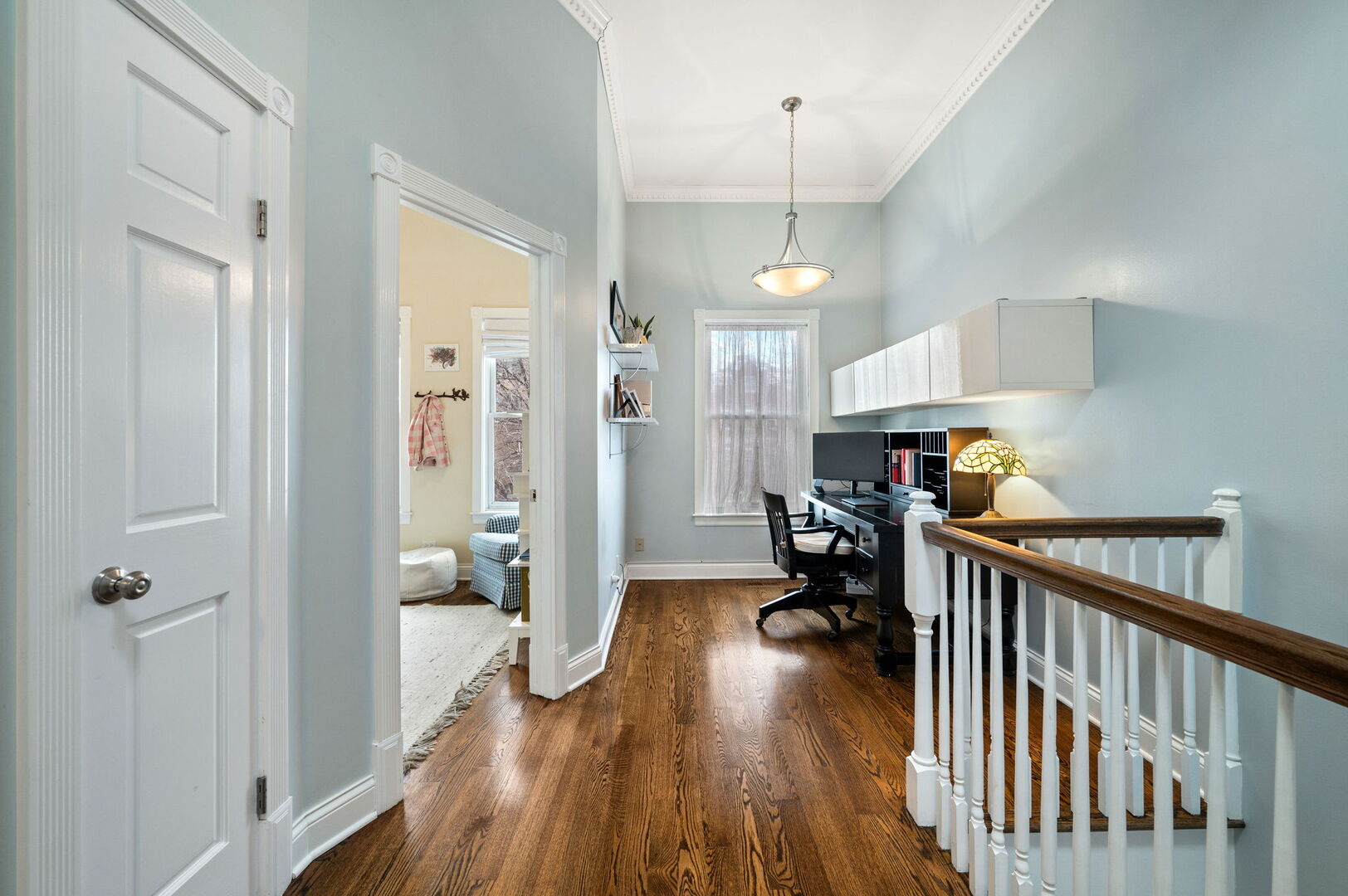 1213 North Paulina Street Chicago, IL 60622 - Photo 21 of 40 a view of a room with wooden floor and furniture