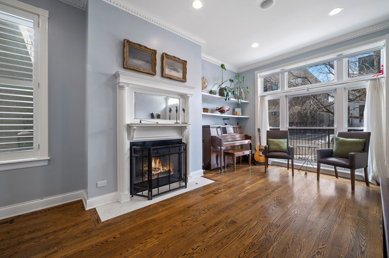 1213 North Paulina Street Chicago, IL 60622 - Photo 3 of 40 a living room with furniture and a fireplace