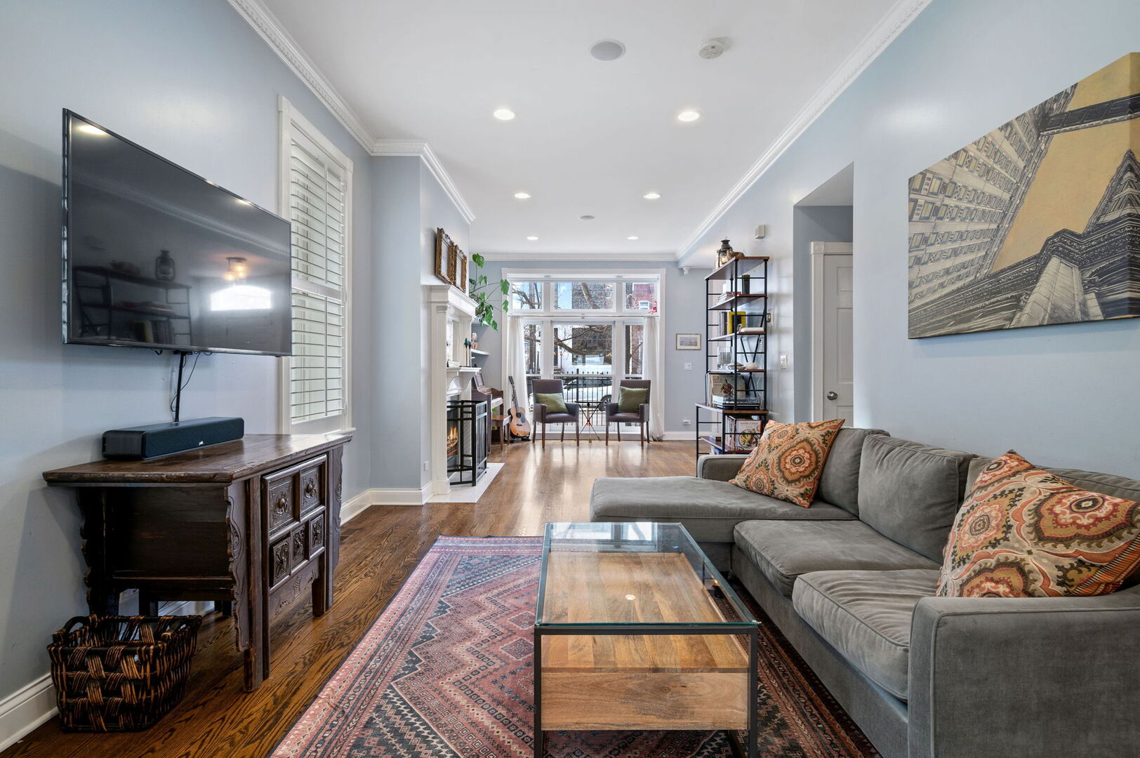 1213 North Paulina Street Chicago, IL 60622 - Photo 7 of 40 a living room with furniture and a flat screen tv