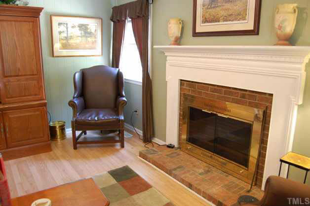 The family room has a masonry fireplace with a beautiful mantle and gas logs. Other