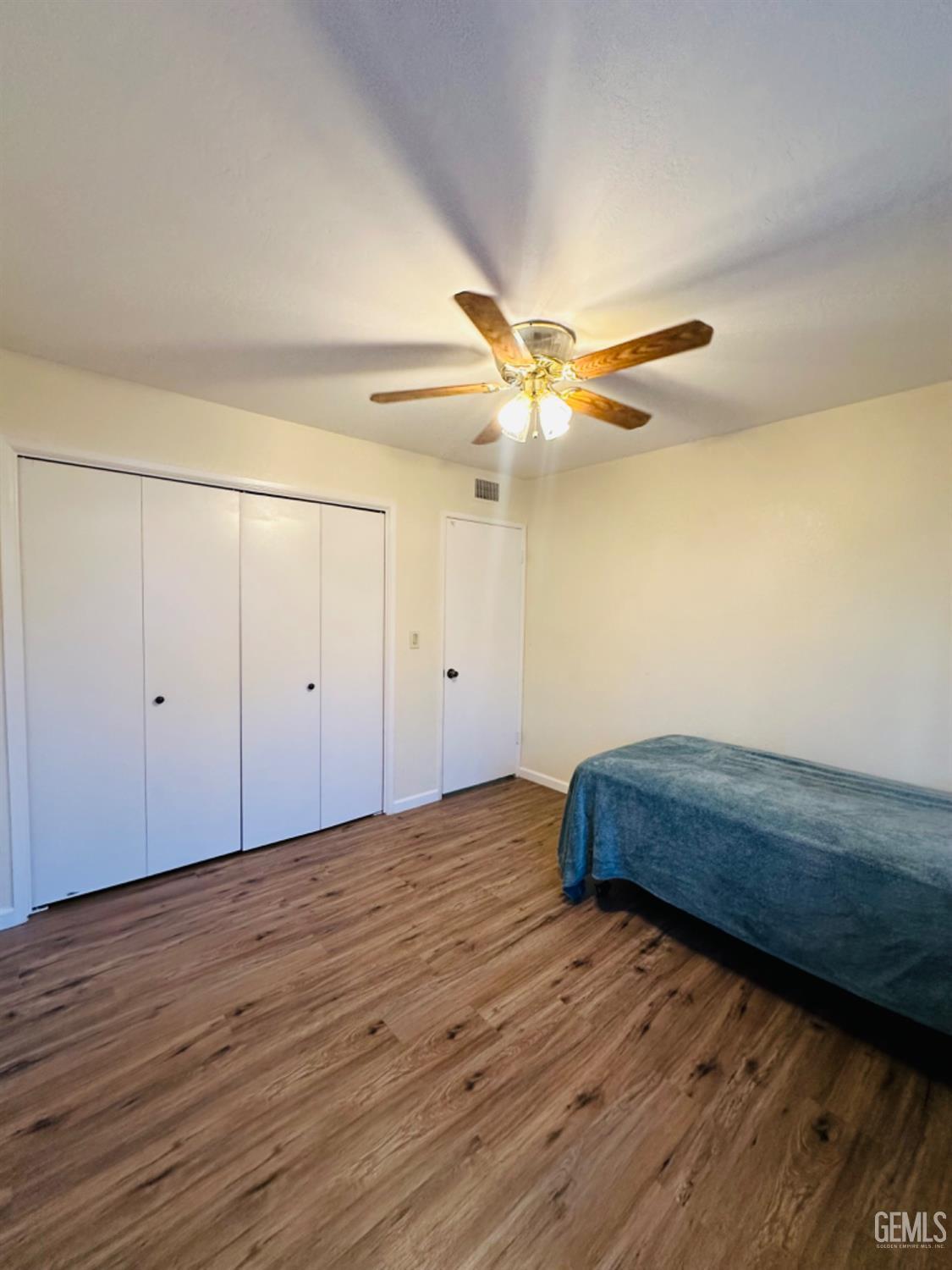 Undisclosed Address Bakersfield, CA 93309 - Photo 16 of 32 a view of room with wooden floor and fan