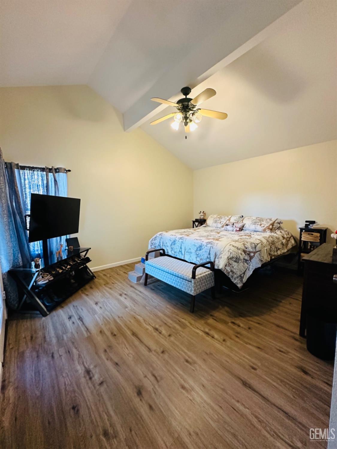 Undisclosed Address Bakersfield, CA 93309 - Photo 20 of 32 a living room with furniture and a flat screen tv