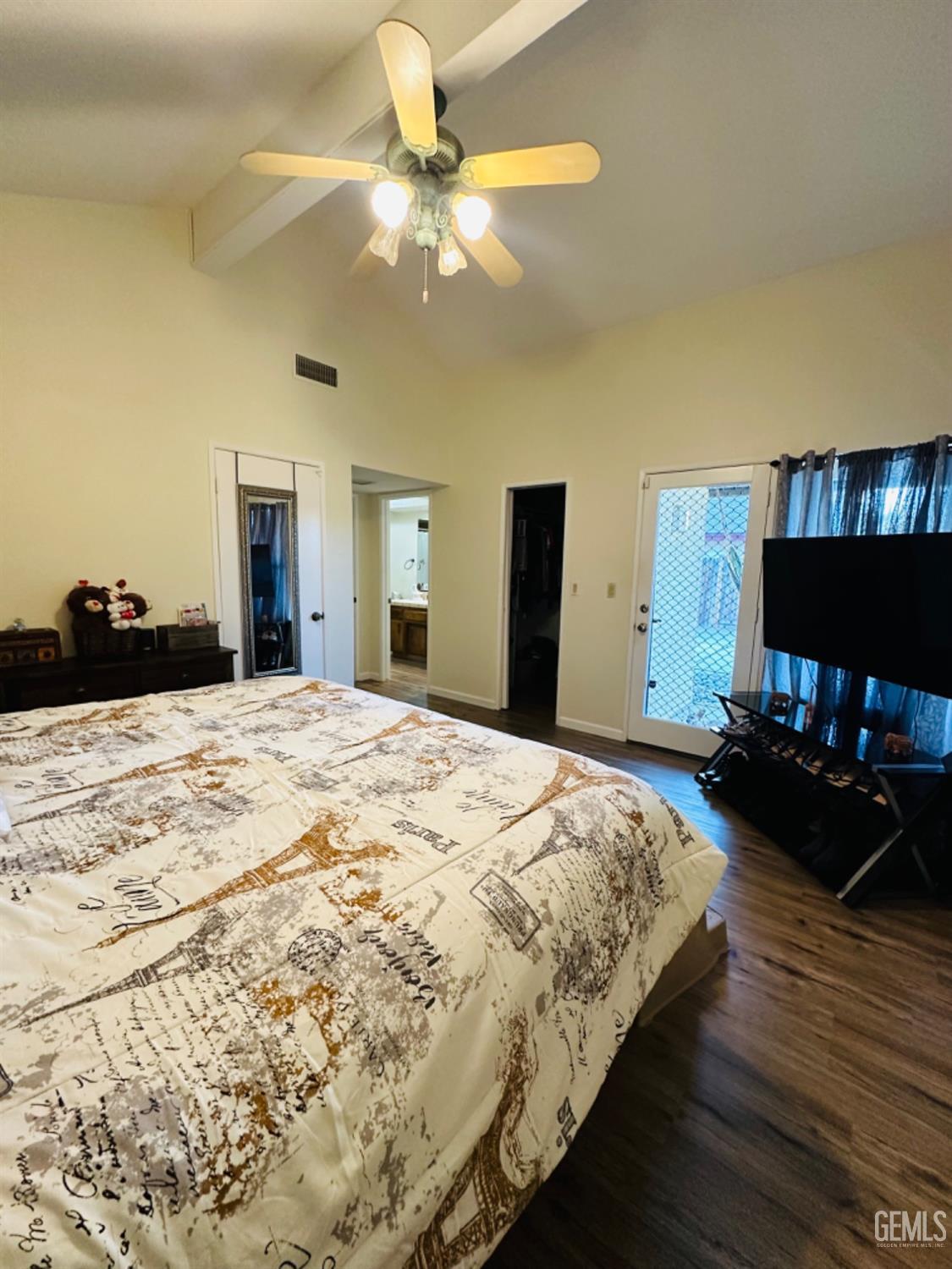 Undisclosed Address Bakersfield, CA 93309 - Photo 21 of 32 a bedroom with a bed and a chandelier