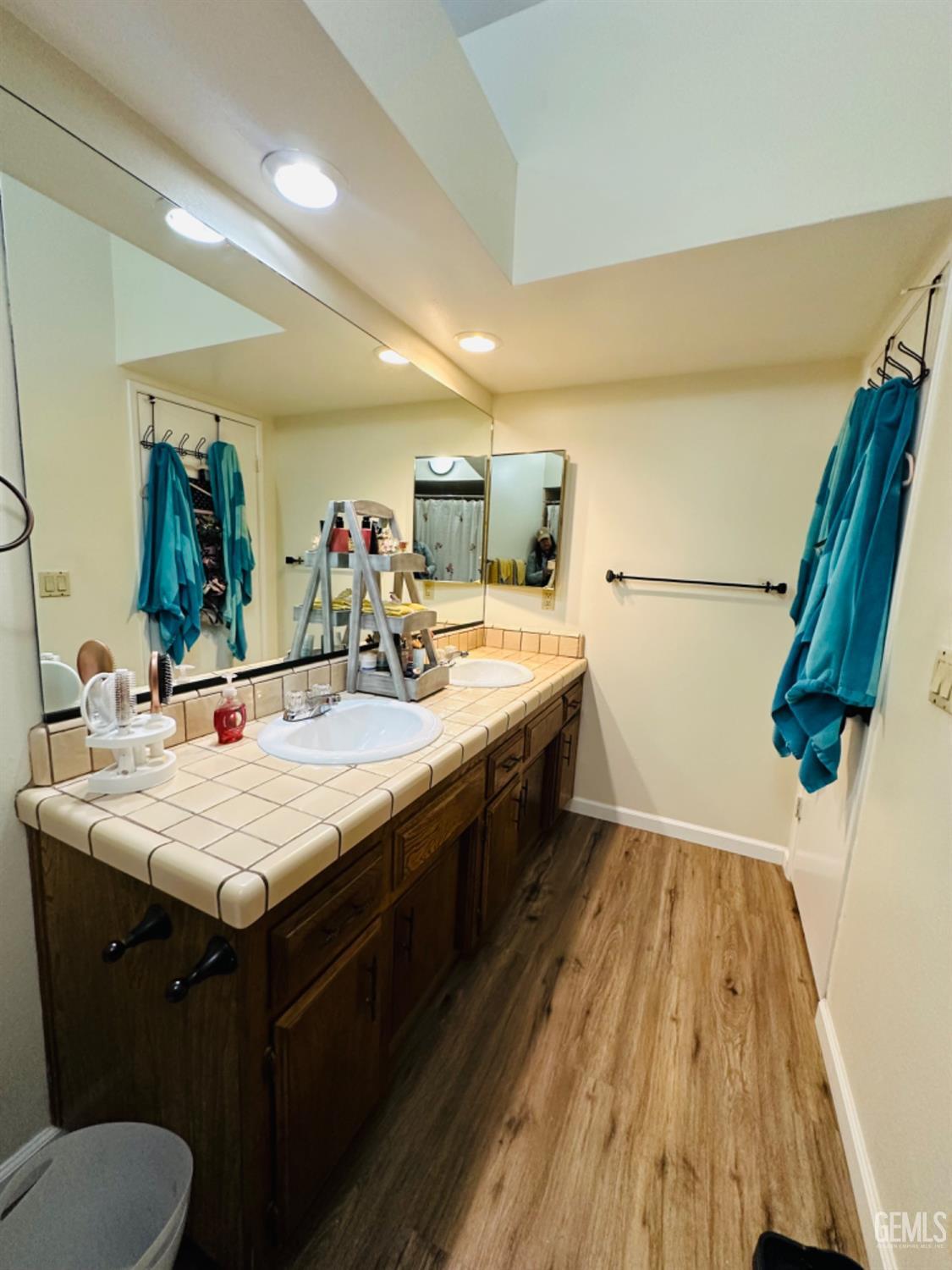 Undisclosed Address Bakersfield, CA 93309 - Photo 23 of 32 a bathroom with a sink and mirror