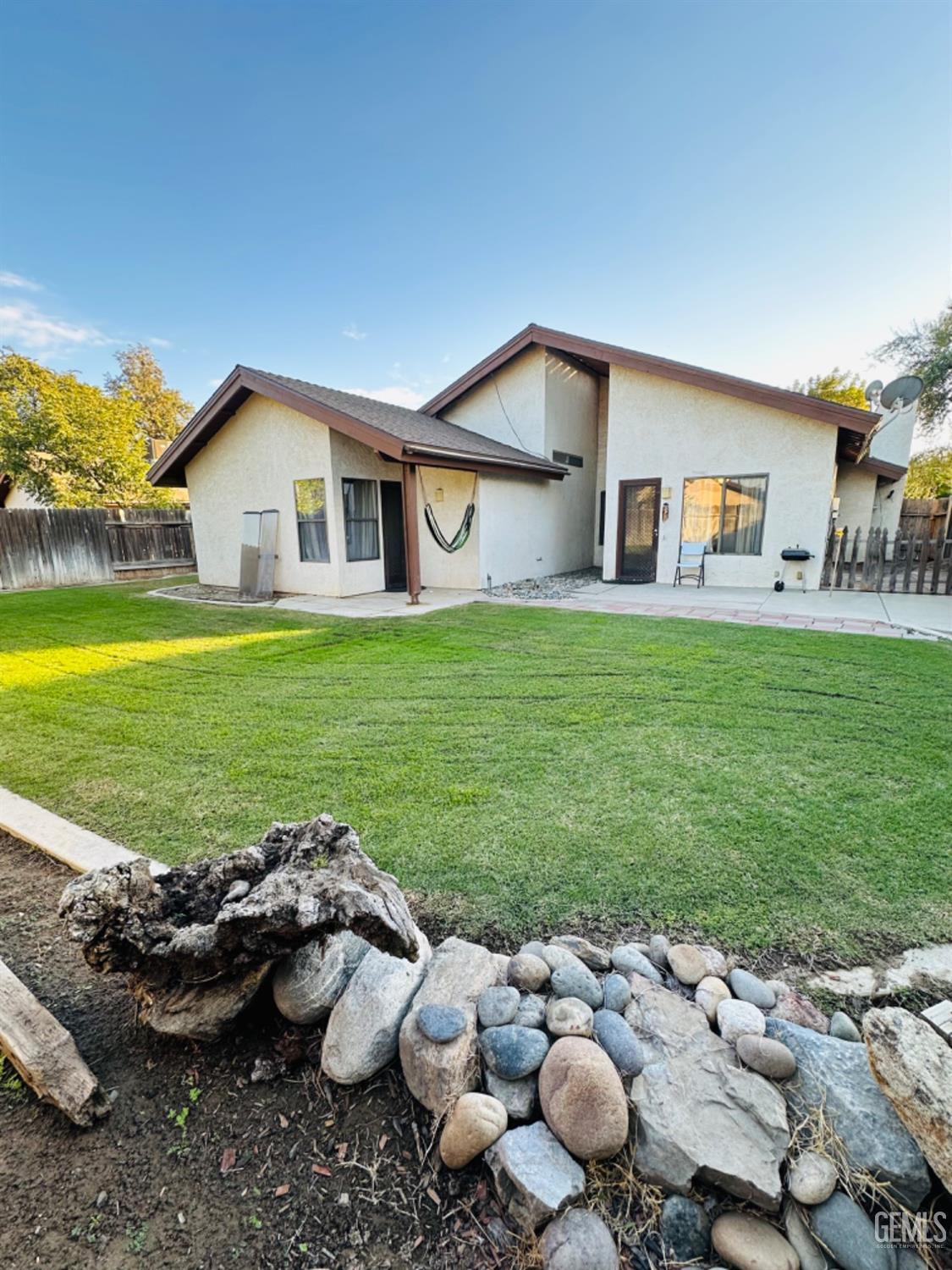 Undisclosed Address Bakersfield, CA 93309 - Photo 27 of 32 a view of a house with backyard and a patio