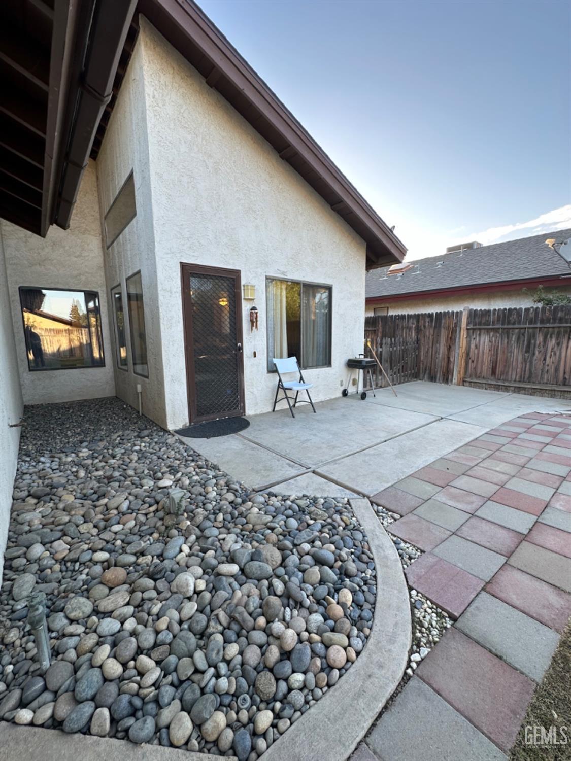 Undisclosed Address Bakersfield, CA 93309 - Photo 30 of 32 a view of a chairs and table in backyard