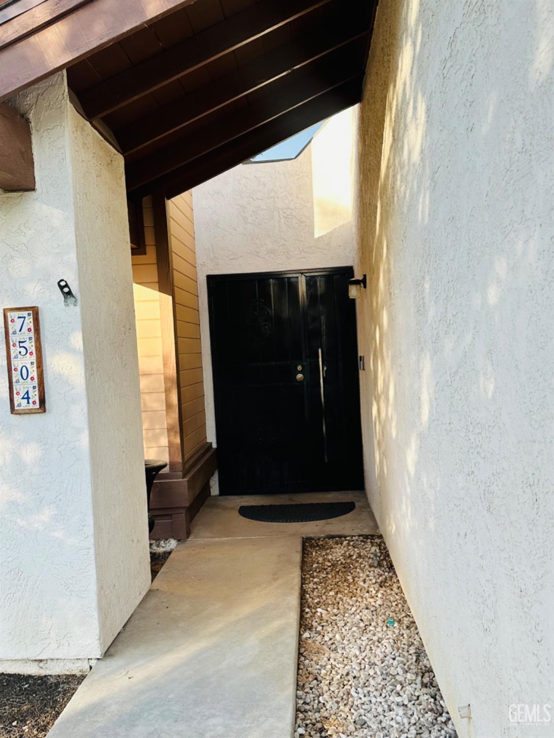 Undisclosed Address Bakersfield, CA 93309 - Photo 4 of 32 a view of a door of the house