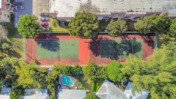 an aerial view of a house with a yard and garden