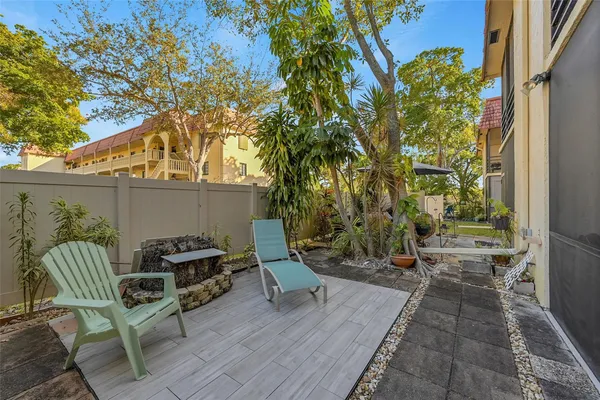a view of two chairs in the balcony