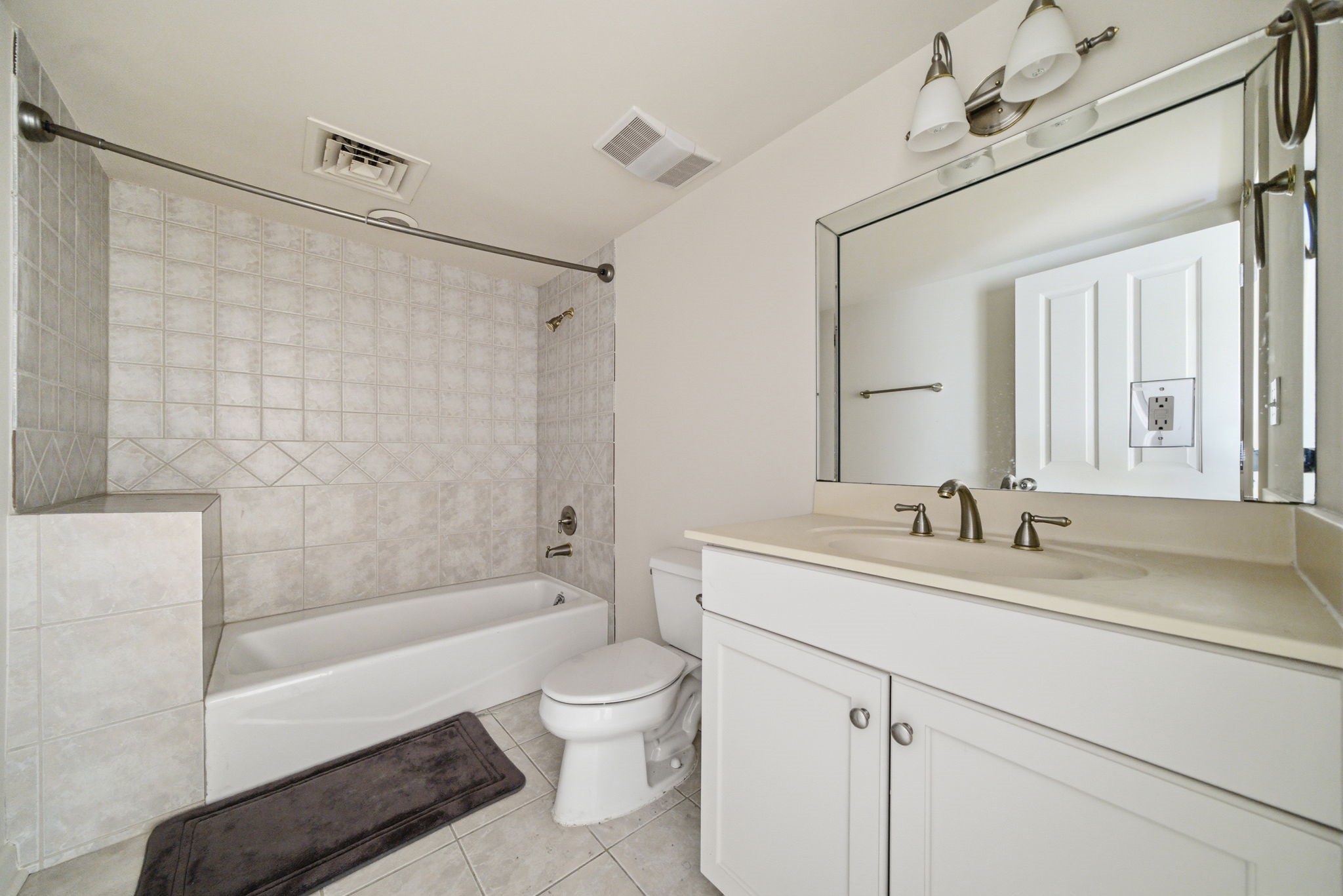914 Main Street, Unit 1108 Houston, TX 77002 - Photo 9 of 24 a bathroom with a sink vanity granite toilet tub and shower