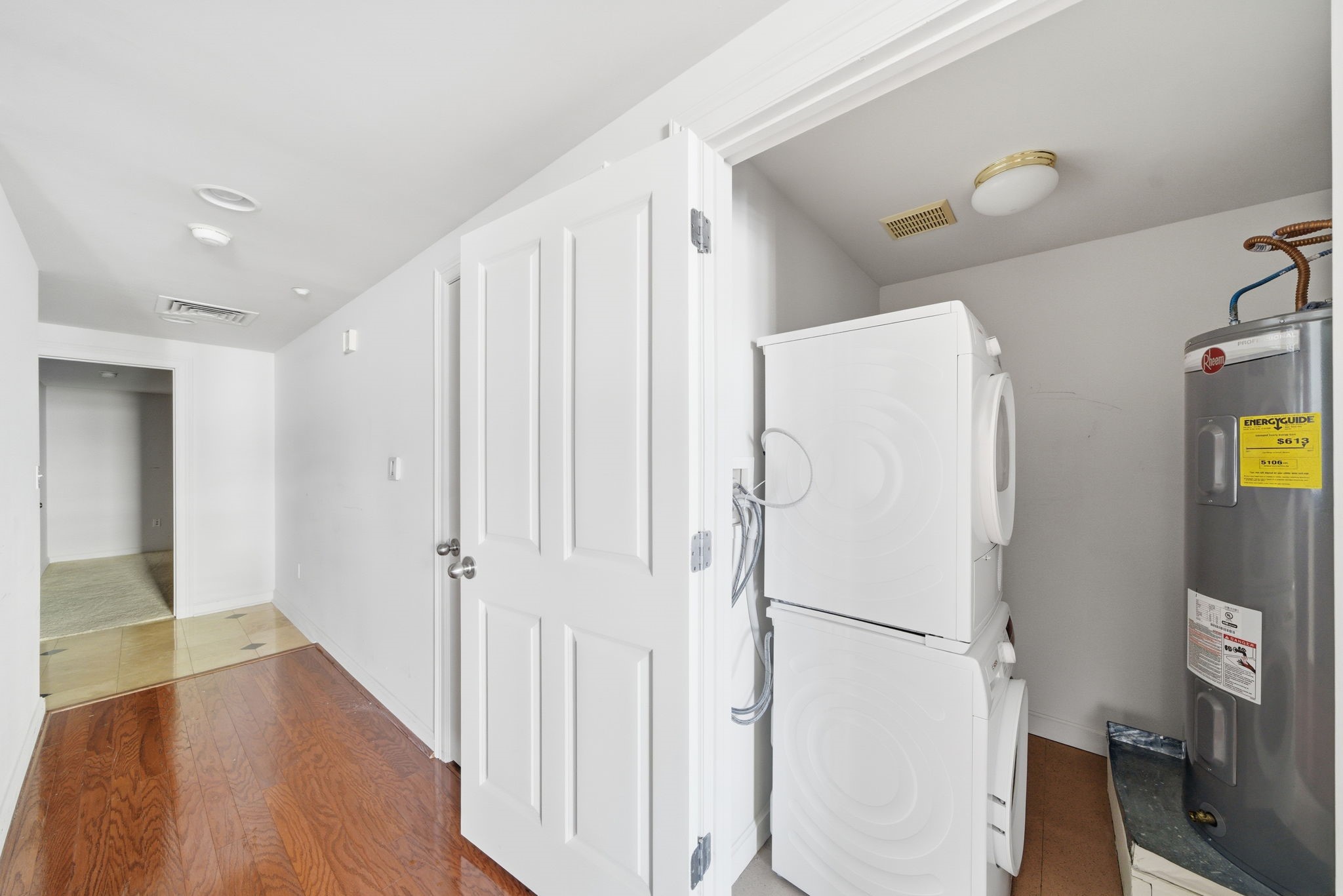 914 Main Street, Unit 1108 Houston, TX 77002 - Photo 10 of 24 a white refrigerator freezer and a wooden floor