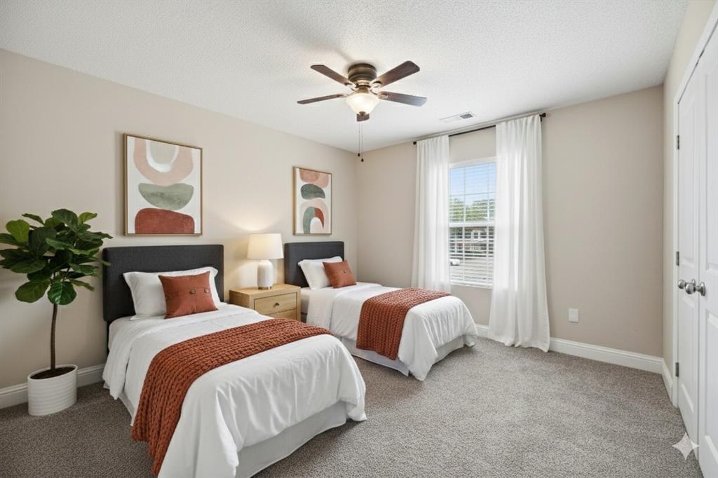 112 Churchill Lane Euless, TX 76039 - Photo 17 of 33 a bedroom with two separate beds and potted plant