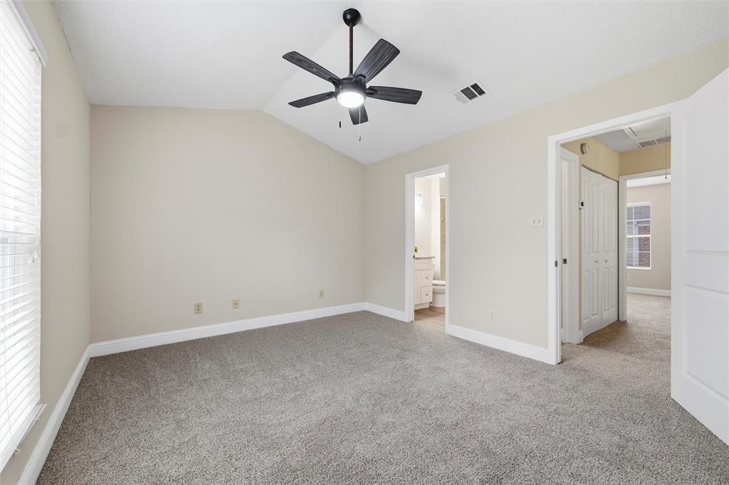 112 Churchill Lane Euless, TX 76039 - Photo 20 of 33 an empty room with closet and windows