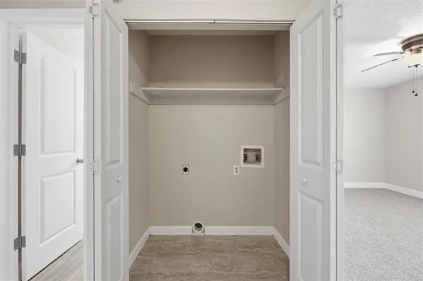 a view of a livingroom and a bathroom