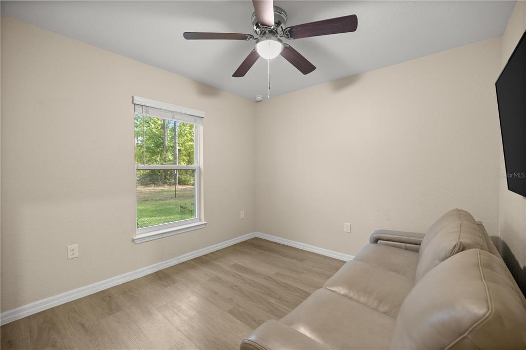 13131 Southwest 73rd Street Ocala, FL 34481 - Photo 16 of 30 an empty room with a window and a fan