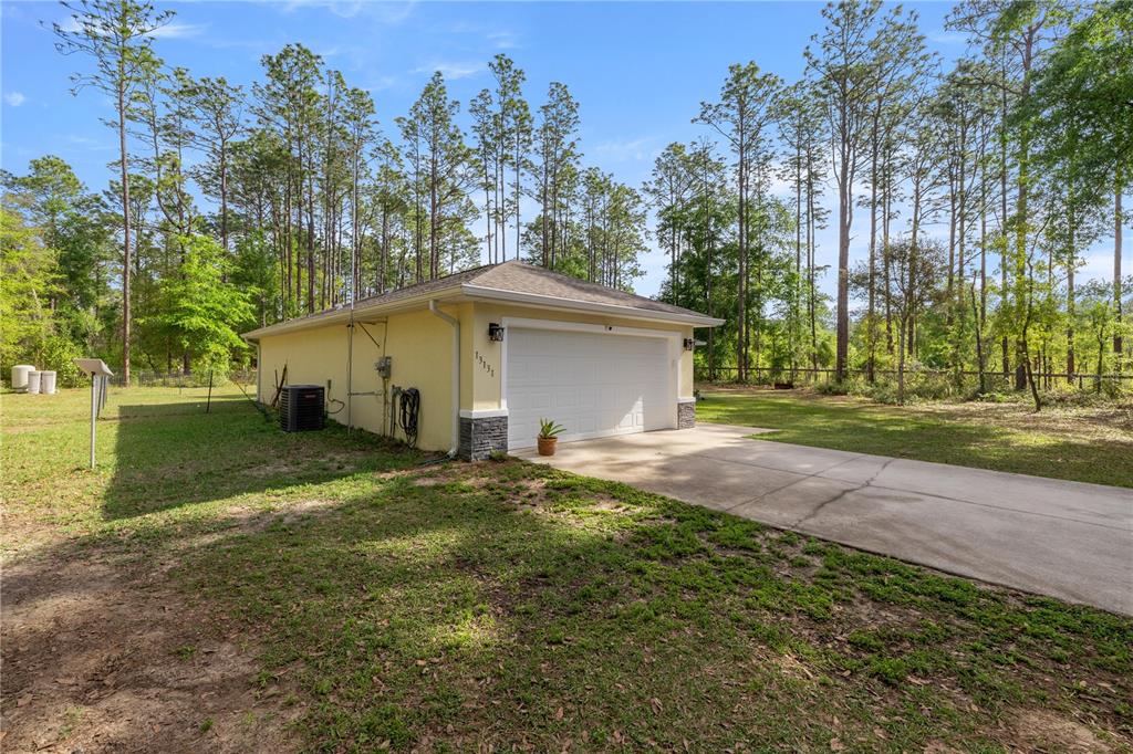 13131 Southwest 73rd Street Ocala, FL 34481 - Photo 24 of 30 a view of backyard of house with green space