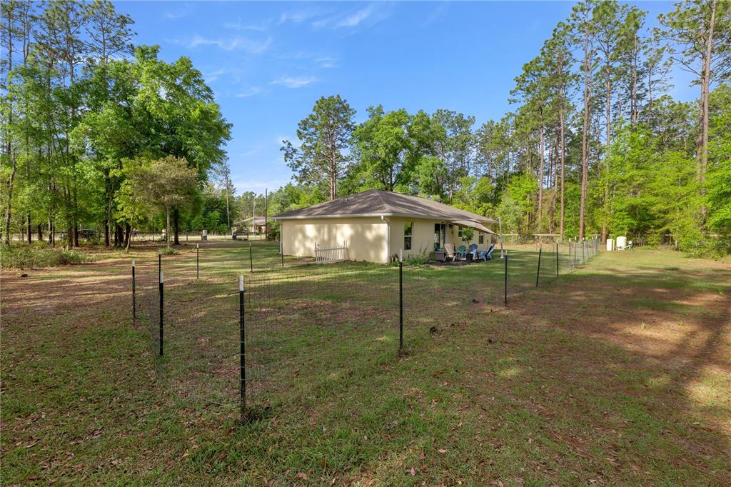 13131 Southwest 73rd Street Ocala, FL 34481 - Photo 29 of 30 a backyard of a house with lots of green space
