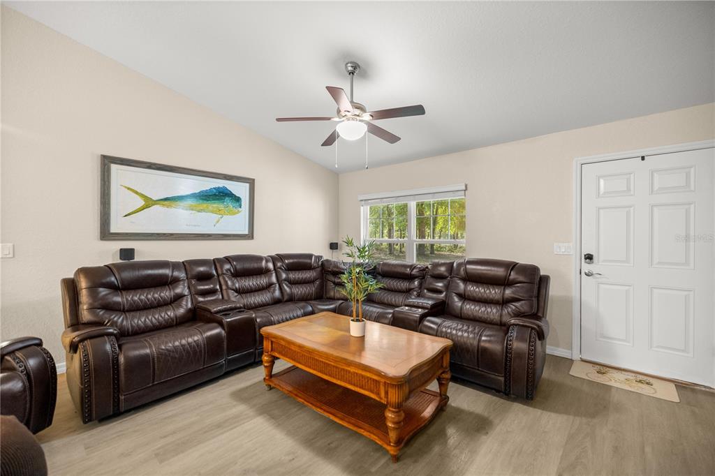 13131 Southwest 73rd Street Ocala, FL 34481 - Photo 4 of 30 a living room with furniture and a ceiling fan