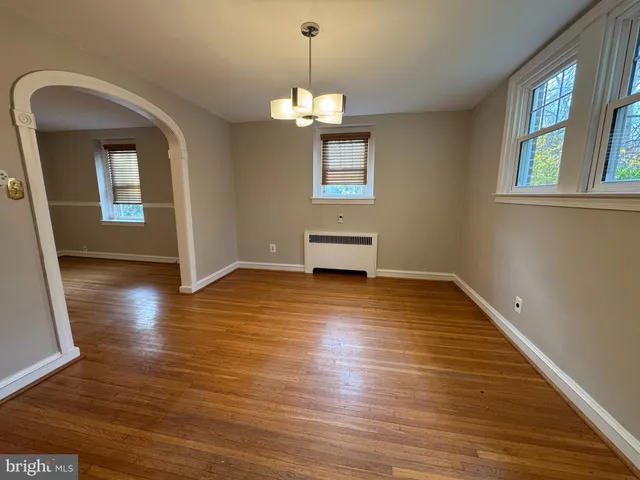 a utility room with cabinets washer and dryer