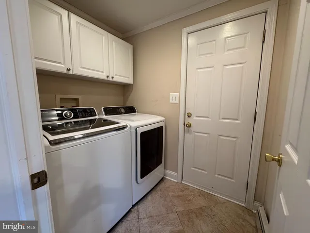 a kitchen with stainless steel appliances a sink and cabinets