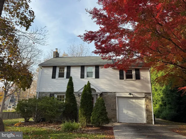 a house that has tree in front of it