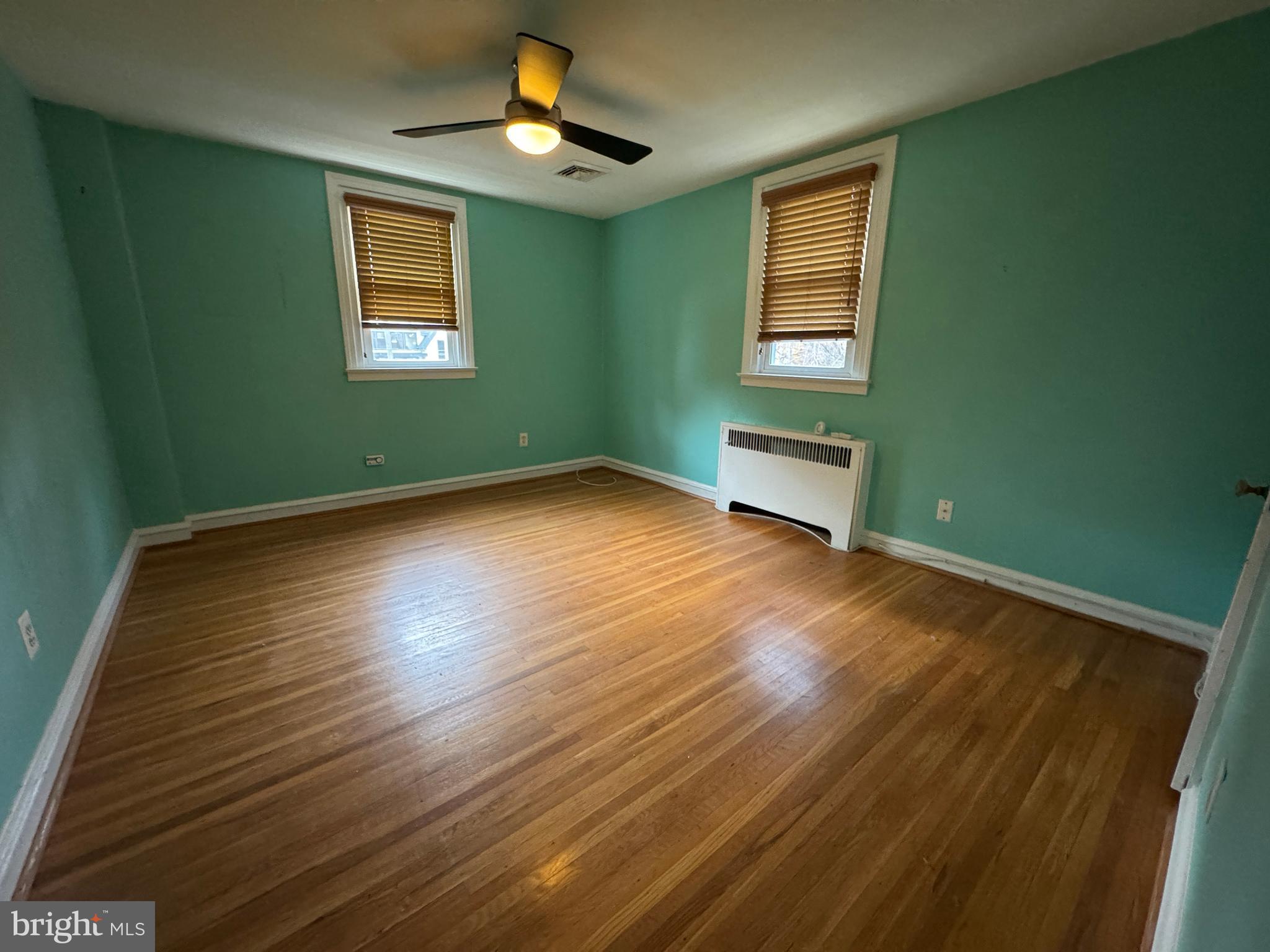 412 Grange Road Wayne, PA 19087 - Photo 24 of 27 a view of empty room with wooden floor and fan