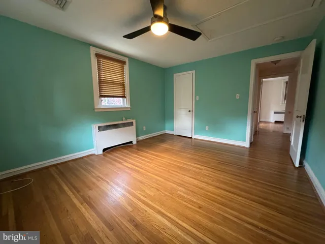 a view of a pathway both side of the house