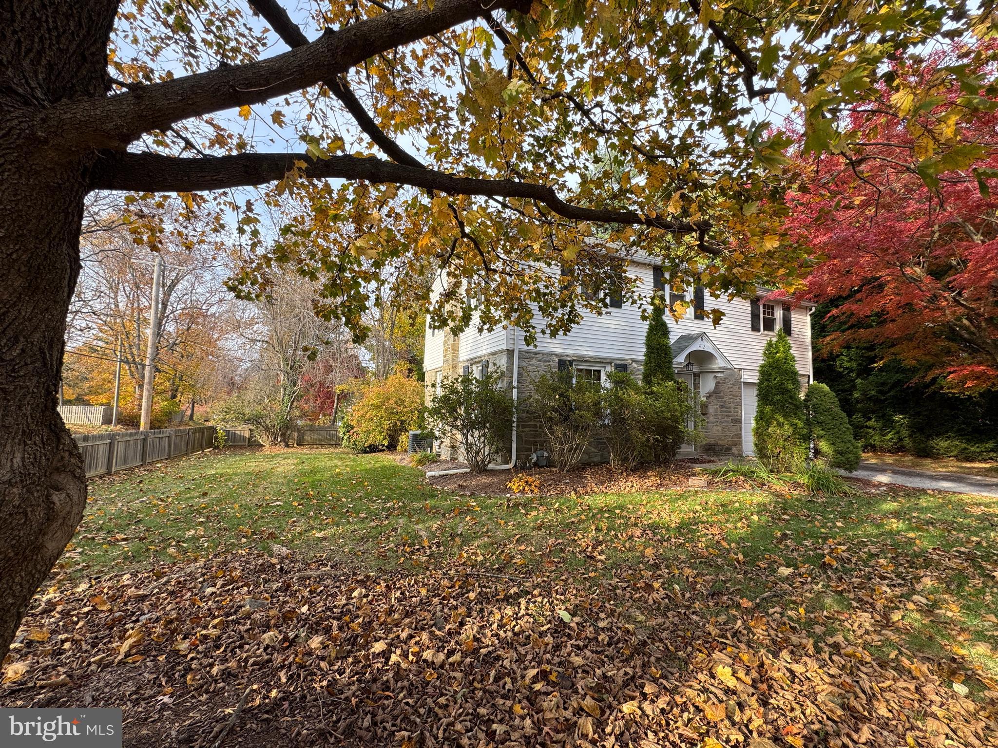 412 Grange Road Wayne, PA 19087 - Photo 4 of 27 a view of a yard with large trees