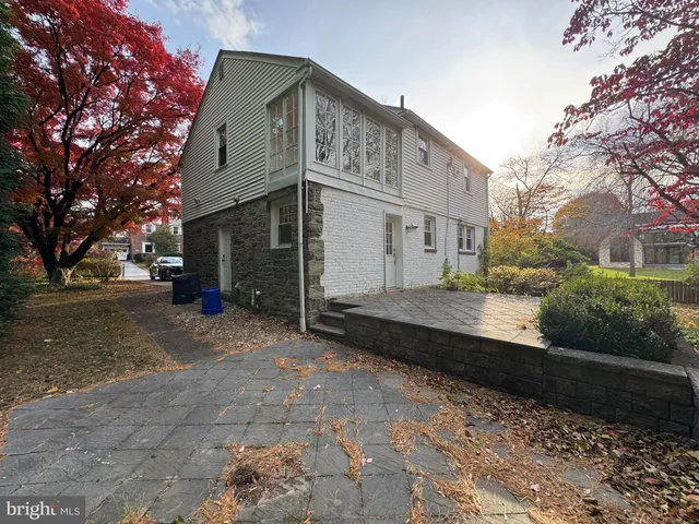 a view of a room with wooden floor and window