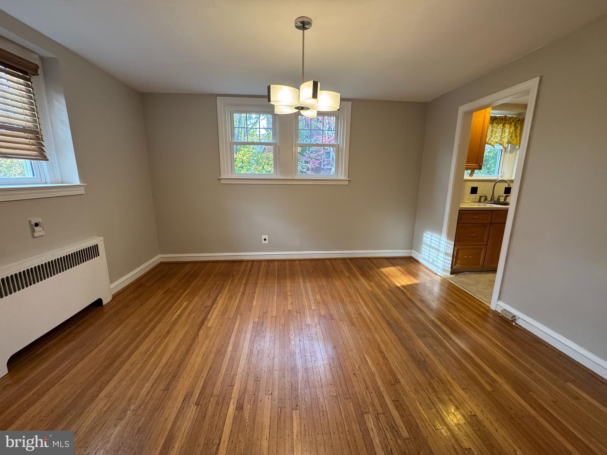 412 Grange Road Wayne, PA 19087 - Photo 10 of 27 a view of empty room with wooden floor and fan