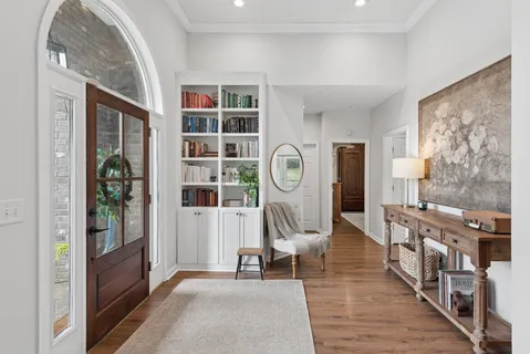 a living room with furniture and a clock