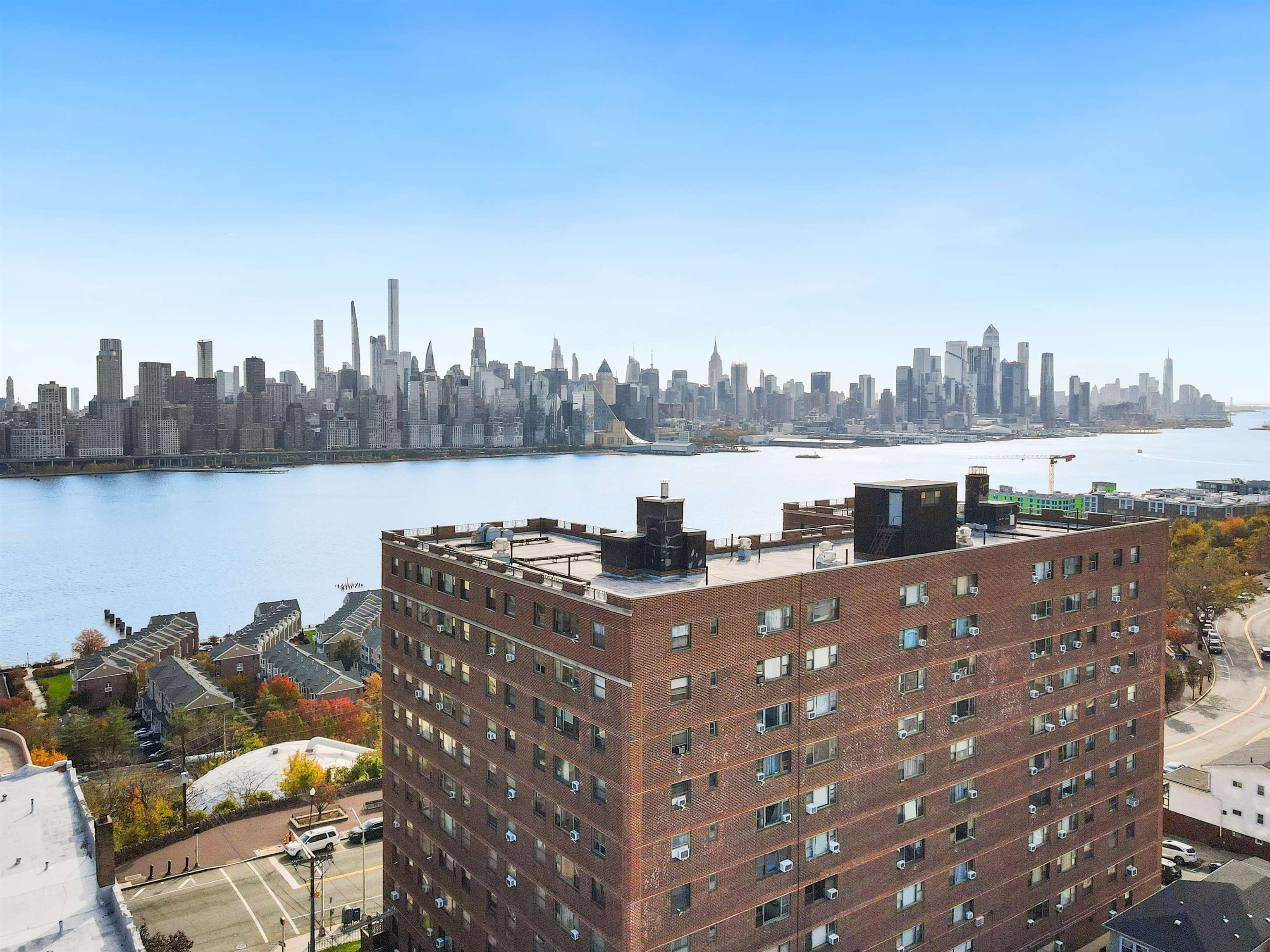 6515 JFK Boulevard East, Unit 4C West New York, NJ 07093 - Photo 13 of 14 a terrace with outdoor seating and city view