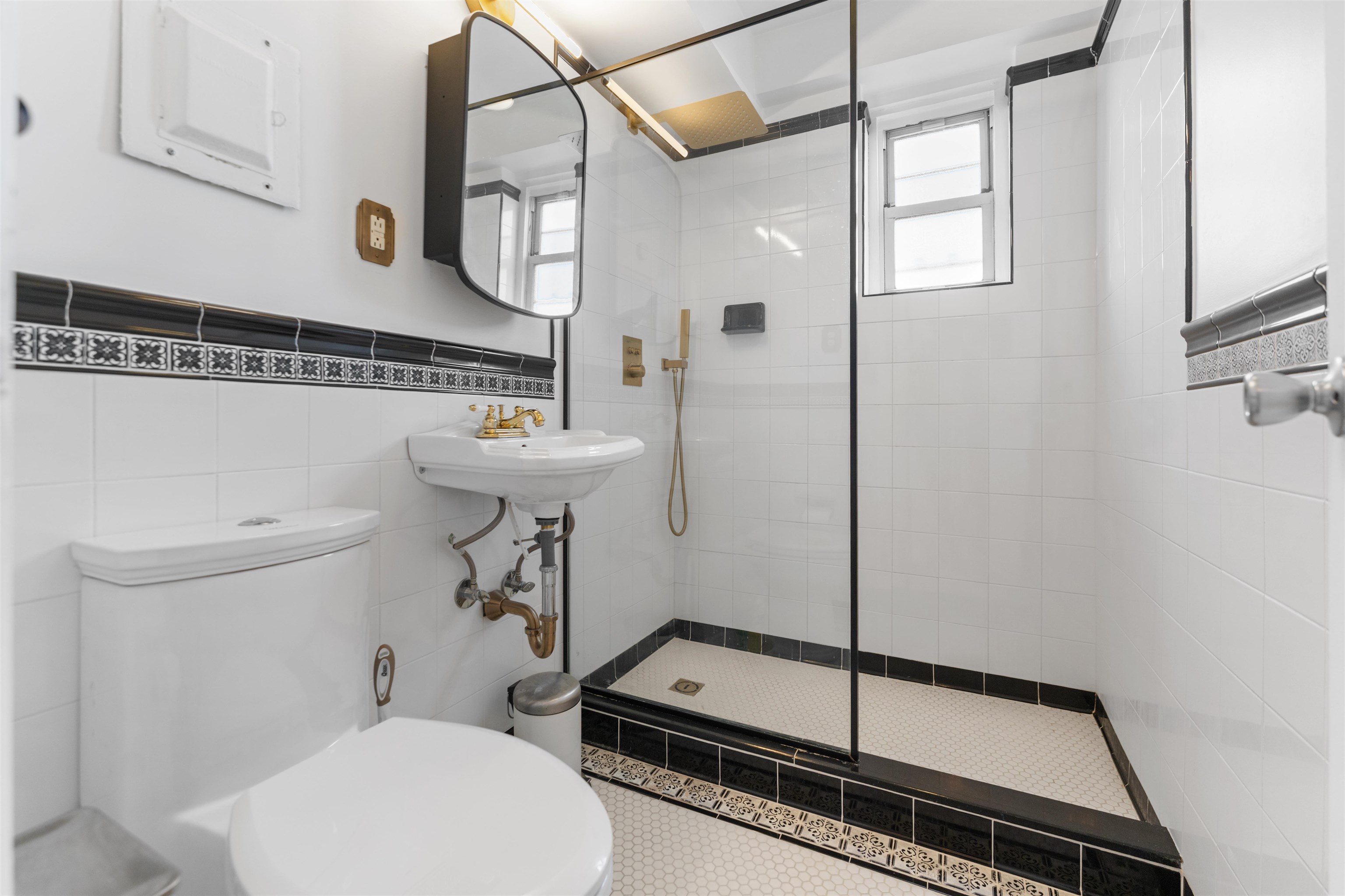 6515 JFK Boulevard East, Unit 4C West New York, NJ 07093 - Photo 6 of 14 a bathroom with a sink a toilet a mirror and shower