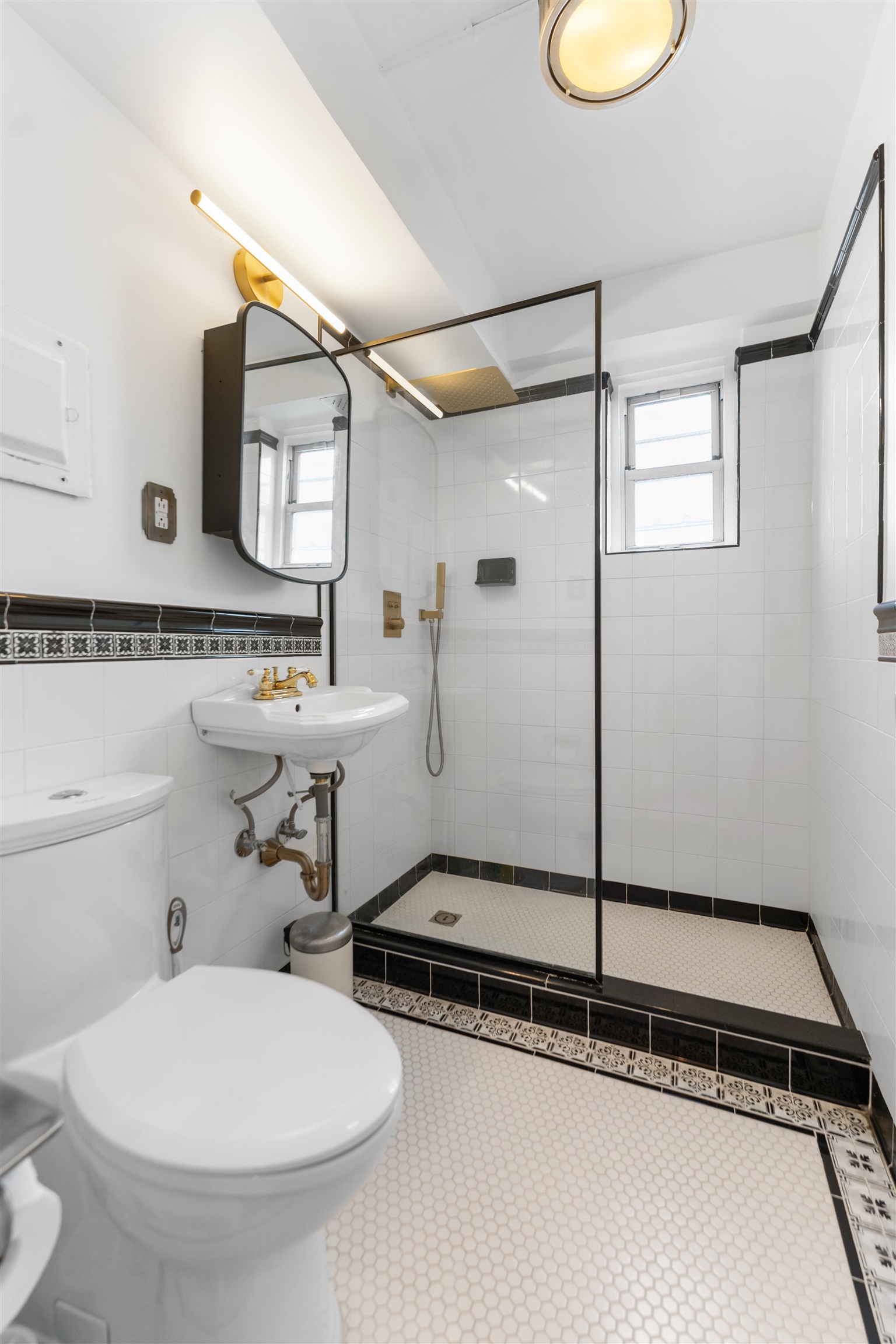 6515 JFK Boulevard East, Unit 4C West New York, NJ 07093 - Photo 7 of 14 a bathroom with a sink and mirror
