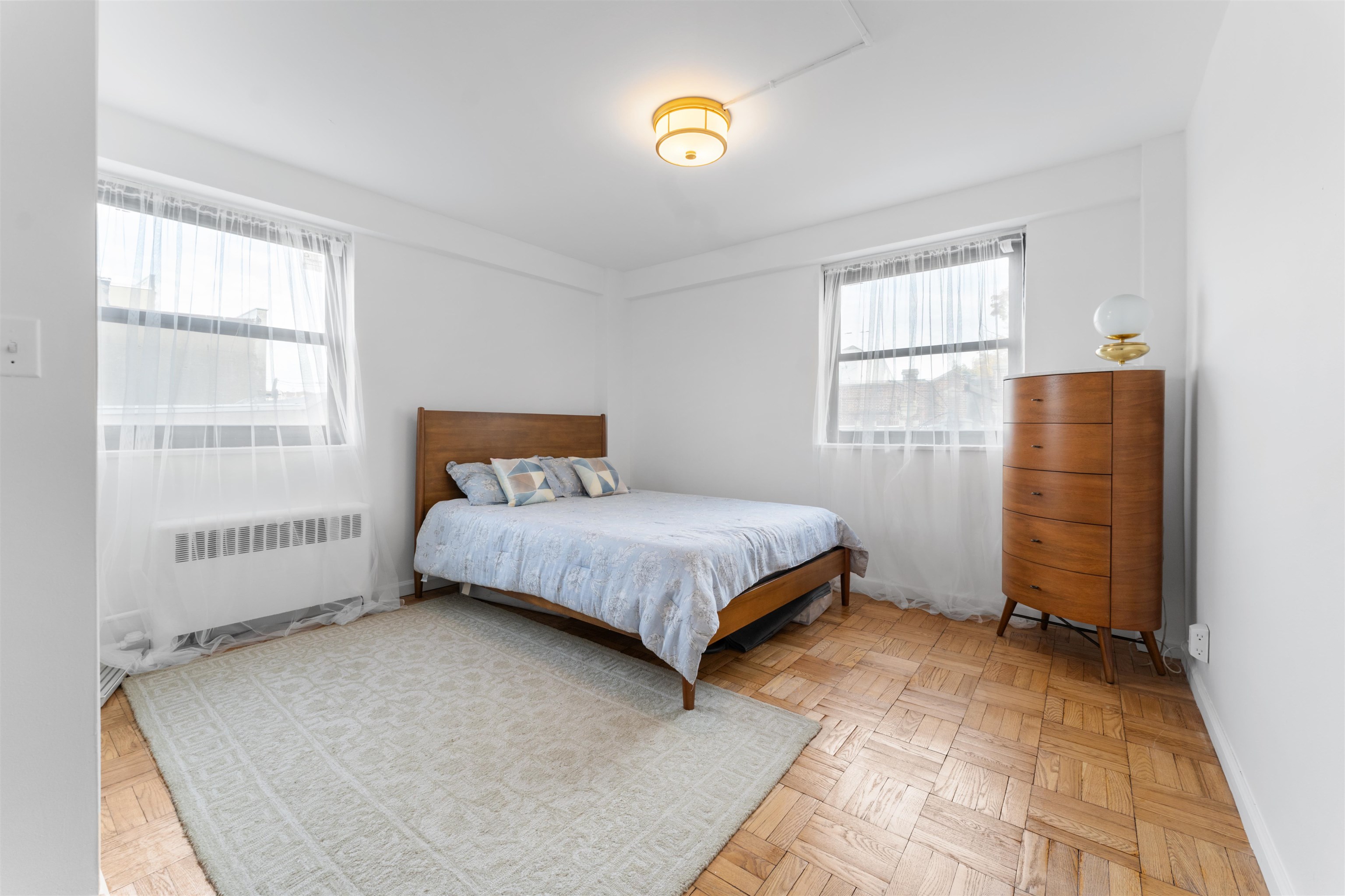 6515 JFK Boulevard East, Unit 4C West New York, NJ 07093 - Photo 8 of 14 a bedroom with a bed and a window