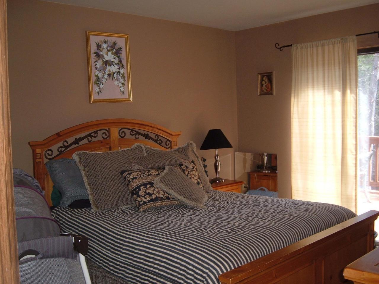 138 English Court Bushkill, PA 18324 - Photo 5 of 10 a bed sitting in a bedroom next to a window