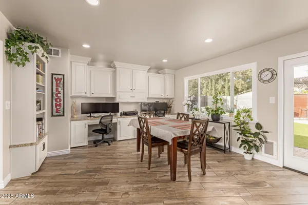 a kitchen with a table and chairs in it