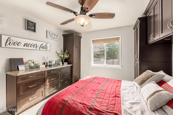 a bedroom with a bed and a dresser