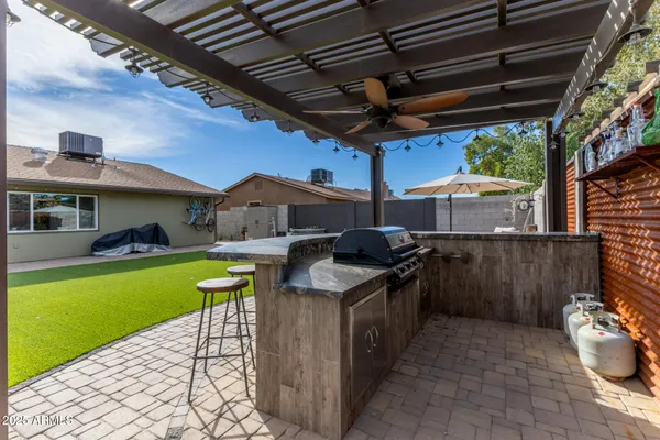 a utility room with lots of trees and stainless steel appliances