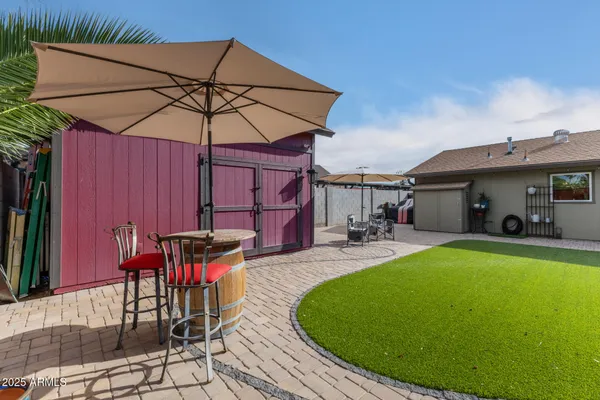 a view of a swimming pool with a patio