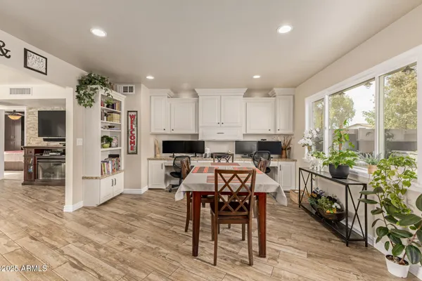 a view of a dining room with furniture window and wooden floor